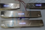 Накладки на пороги стальные с LED подсветкой JMT Toyota Hilux 2005-2015