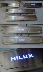 Накладки на пороги стальные с LED подсветкой JMT Toyota Hilux 2005-2015