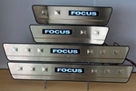 Накладки на пороги стальные с LED подсветкой JMT Ford Focus II 2005-2010